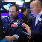 Traders work on the floor at the New York Stock Exchange (NYSE) in New York City, U.S., March 7, 2024.