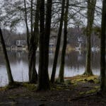 Roamingwood Lake, one of several lakes in the Hideout, a gated community in the Pocono Mountains of Pennsylvania, on April 1, 2024, where the full-timers and short-term rental owners are locked in a battle over the right to rent. (Noah Kalina/The New York