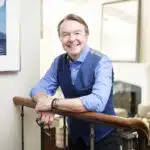 Michael Clinton, who retired from Hearst Magazines in 2020 and wrote the bestseller “Roar: Into the Second Half of Your Life (Before It’s Too Late),” at his apartment in New York, April 9, 2024. (Karsten Moran/The New York Times)