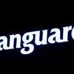 The logo for Vanguard is displayed on a screen on the floor of the NYSE in New York