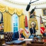 President Donald Trump speaks to reporters as he signs initiatives and executive orders.