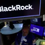 Traders work on the floor of the NYSE in New York